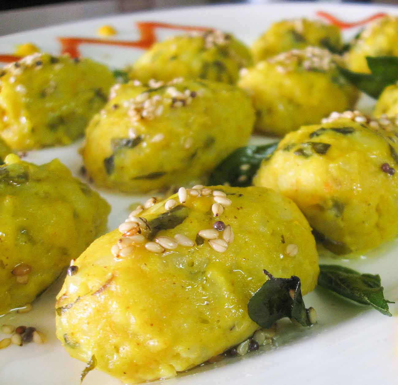 Dudhi muthiya with tomato saar